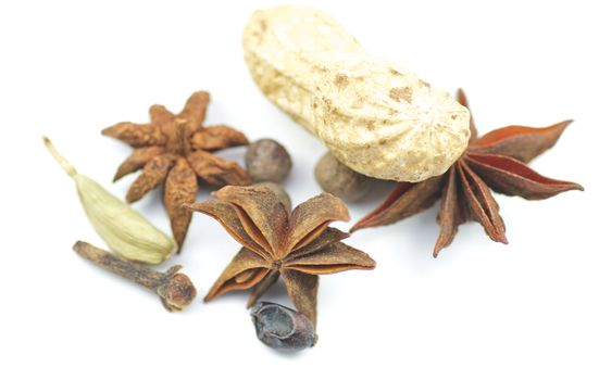 Anise, cardamon and nut isolated on white background