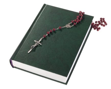 rosary on the Bible, isolated on white