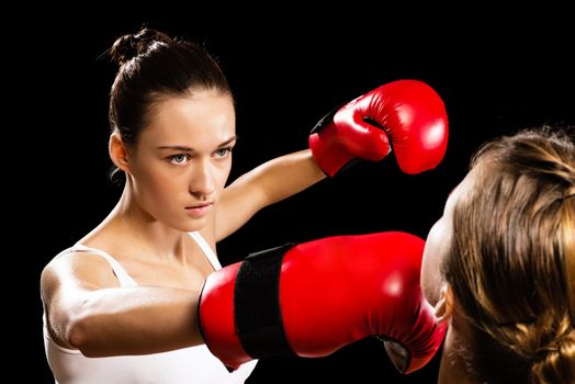 Aggressive boxing woman, hits an opponent in the head