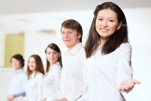 group of people holding hands, woman holds out her hand, the concept of teamwork