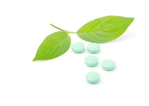 Pills with green leaf isolated on a white background. Herbal Medicine.  