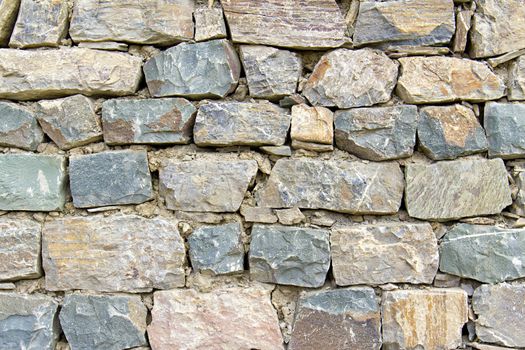 wall of rough stones in the background