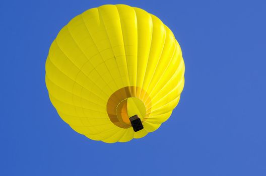 yllow hot air balloon in blue sky
