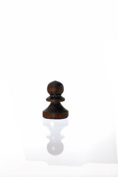 One Chess Pawn on white background with faint reflextion.