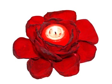 Red roses leavs and glowing candle isolated on white background. 