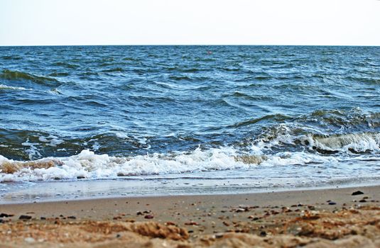 Sand beach and sea surf. 
