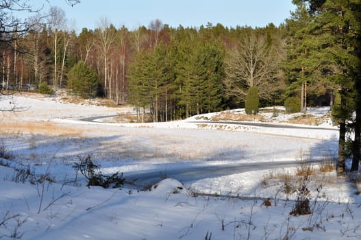 A small crooked road during winter in Sweden.