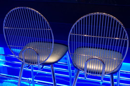 chrome seats with blue neon glow