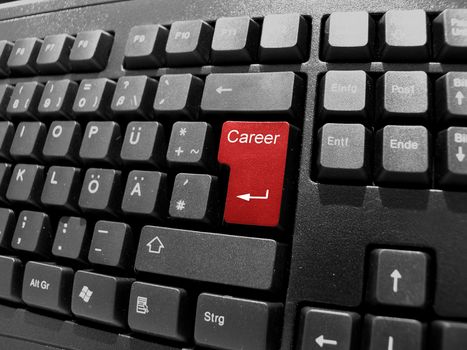 black keyboard with red key career
