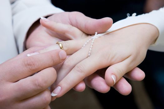 putting on wedding ring