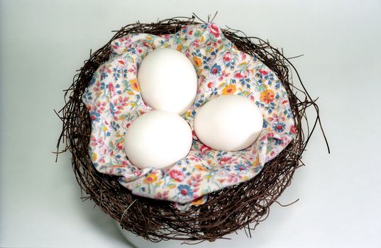 Eggs in the nest with textile decoration