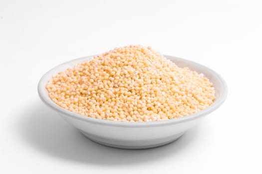 Small plate with yellow millet on white