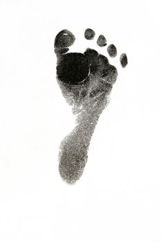 New born baby's foot print in black on white background.