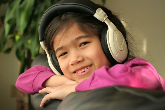 Six year old listening to music with headphones