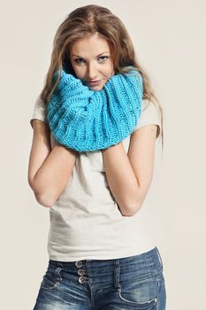 Beautiful girl in a blue scarf