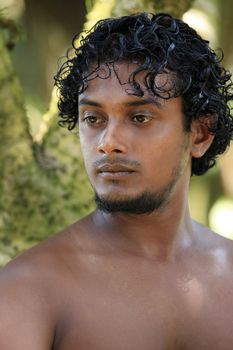 Portrait young men on a green background. Sri Lanka