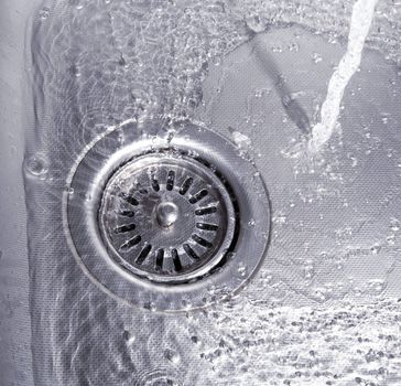 Close-up of kitchen sink with water drops