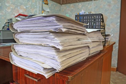 heap of the papers on table in office