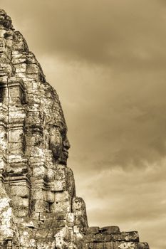 Stone face profile on the Bayon temple in Cambodia