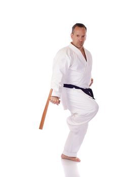 Man in karate-gi with two tonfa in his hands