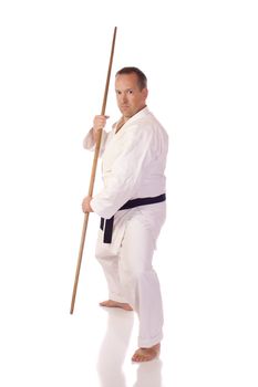 Man in karate-gi with a bo (staff) in his hands