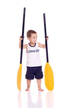 Cute little boy with paddles