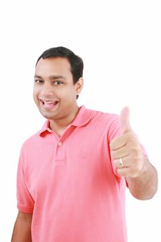 Portrait of a happy young man showing good job sign against white background