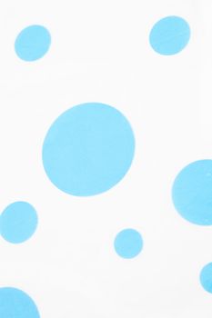 Fresh pattern of scattered blue circles or polka dots on a white background