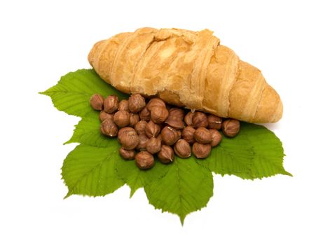 Croissants with chocolate and nuts on the white