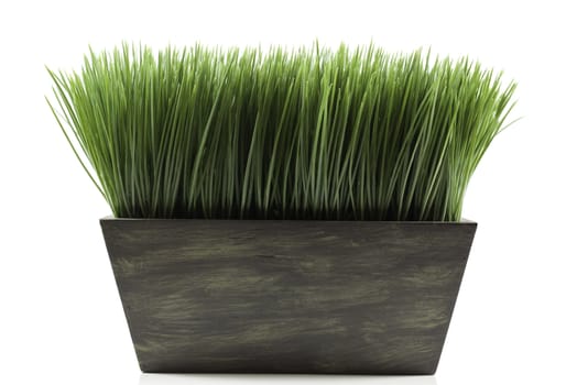 a brown planter box with green grass