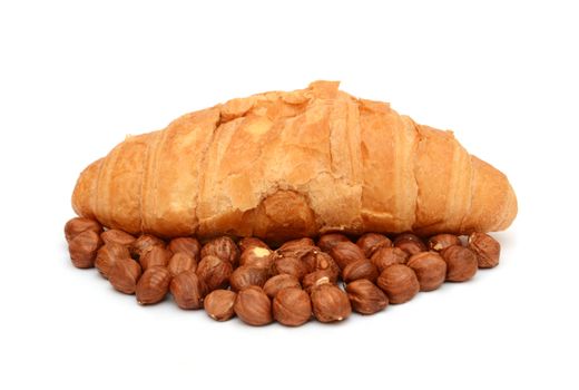 Croissants with chocolate and nuts on the white background