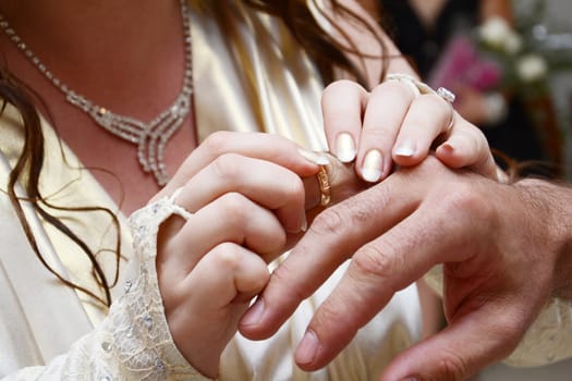 Hands and rings on wedding 