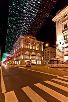 A very long string of christmas lights forming the Italian flag during Christmas in Rome
