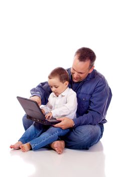 Father and son sitting with a laptop