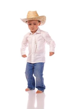 Little boy with a cowboy hat dancing