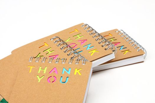 Notebook with the words thank you cut the cover. Recycle notebook concept 