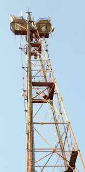 Telecommunication mast with blue sky background 