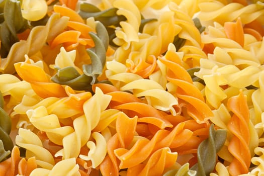 Multicolored pasta with the addition of natural tomatoes and spinach