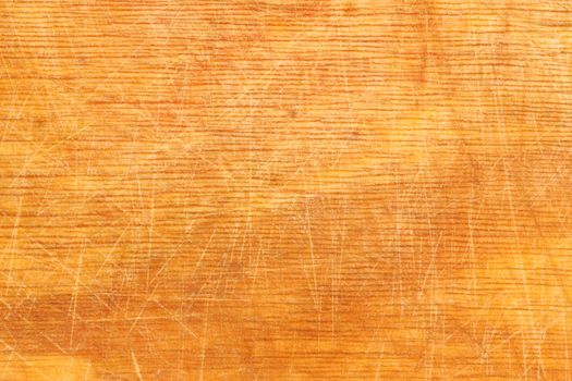 Well-used wood chopping board providing good texture for backgrounds