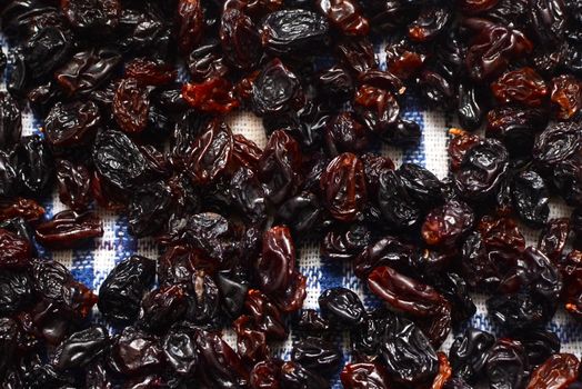 Raisins of ripe grapes on a background