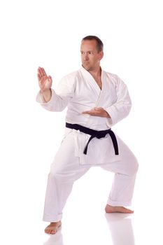 Man in traditional clothing doing karate