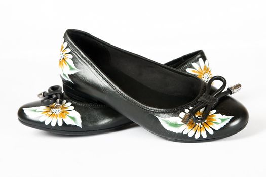 black women shoes with printed flower on white background