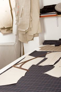 Tailor studio, fabric, paper sewing pattern, ready to make a suite