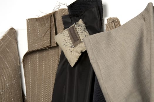 piece of fabric and pattern ready to be assembled in suit, tailor studio