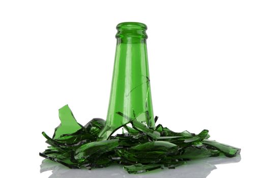 close up of broken green bottle on white background