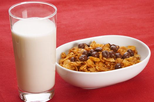 Delicious breakfast foods over red fabric background