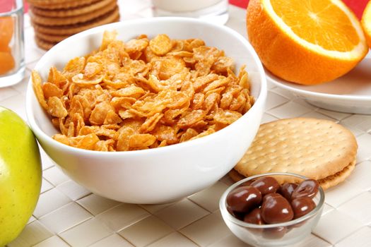 Delicious breakfast foods, cereals, fruits milk and biscuits