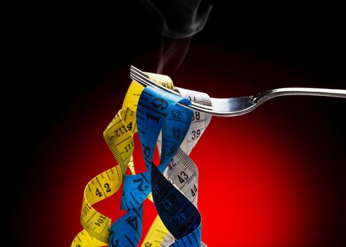 Tape measure pretending to fetuccini in a fork