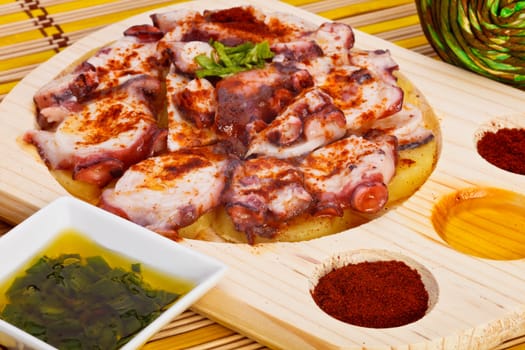 Octopus with paprika, potatoes and olive oil typical of Galicia, Spain