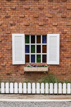 white retro window on the red brick wall